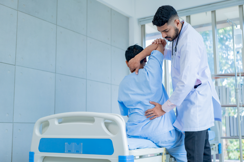 Man with Back Pain with Doctor